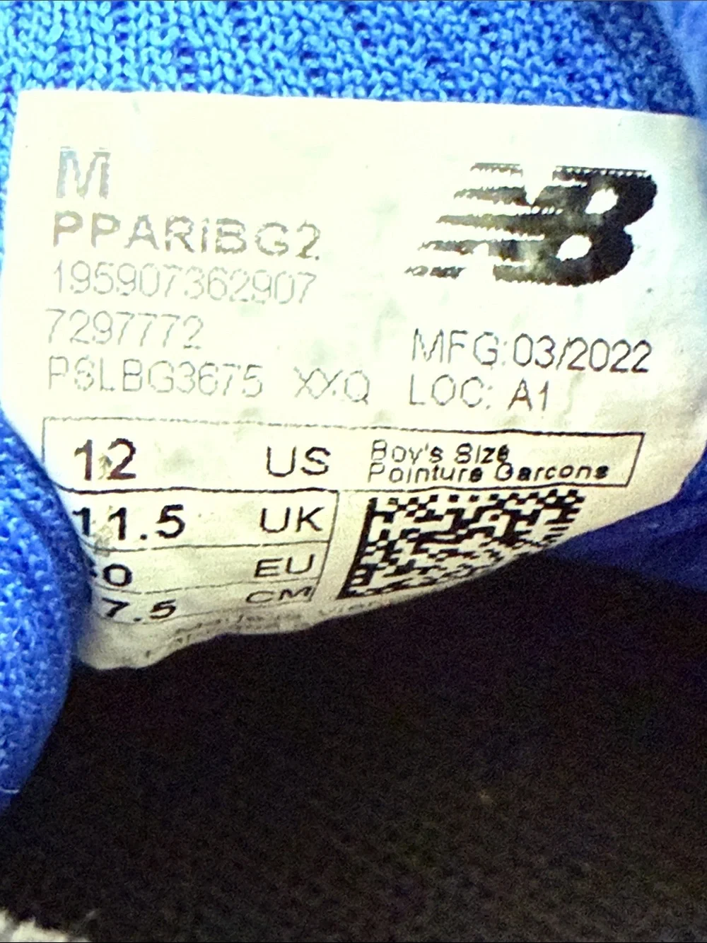E New Balance Kids 13 Black Sneakers with Blue N Logo and Coral Accents
